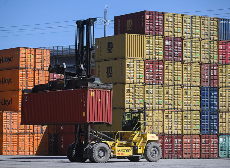 A shipping container is moved at a freight yard in Montreal on Aug. 21, 2026.