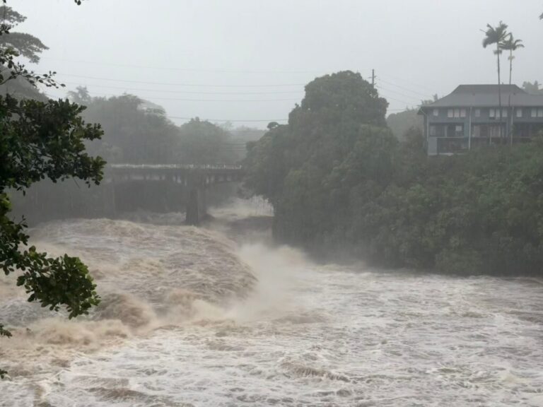 A view of the rising water levels at the Wainaku Street Bridge in Hilo on the Big Island of Hawaii, Saturday, Aug. 15, 2026.