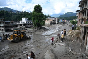 Experts warn more flooding might hit Nepal. And, Fed chairman to give key address