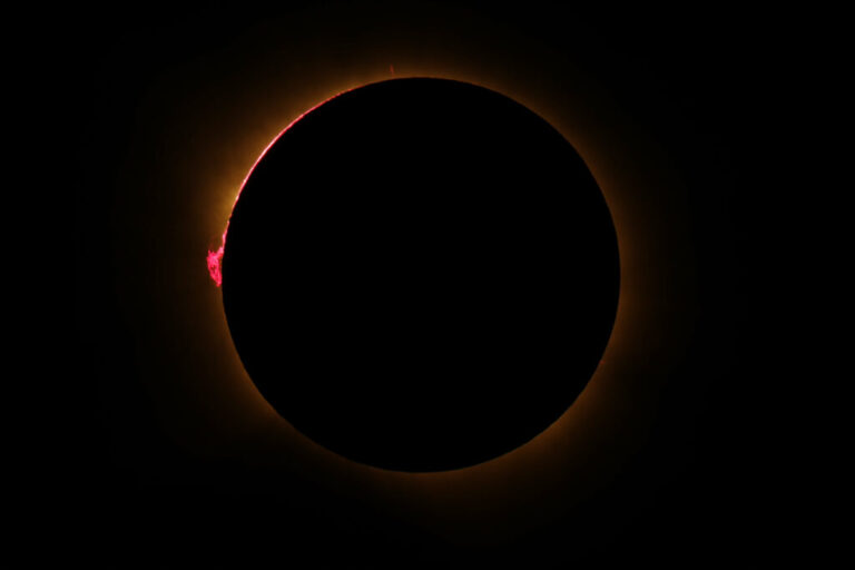 The Sun's corona glows as the Moon completely blocks the Sun during the totality phase of the total solar eclipse as seen from Lodoso, Burgos province, Spain.