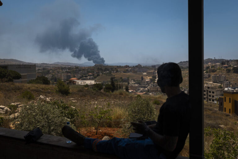 A member of the paramedic team watches a column of smoke rise after an Israeli strike in Nabatiyeh, Lebanon. The fragile ceasefire between Israel and Hezbollah quickly collapsed, with fighting intensifying across southern Lebanon and the Bekaa and casualties continuing to rise. The escalation followed strong Israeli statements calling for increased military action and confirming ongoing operations in the south.