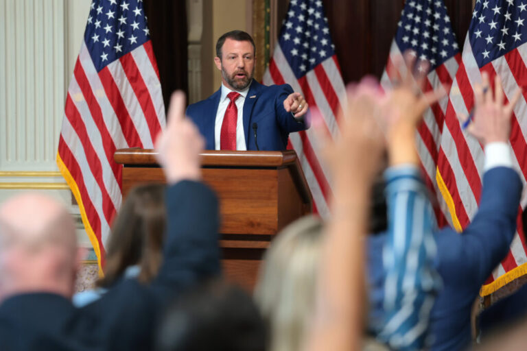 Secretary of Homeland Security Markwayne Mullin answers questions from reporters on July 17 after remarks about his agency alleging that more than 250,000 non-U.S. citizens are on the voter rolls in just four states. Those states dispute that tally.