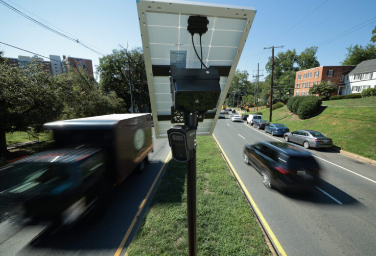 Traffic flows past an Axon brand automated license plate reader (ALPR) camera in Silver Spring, Md. on August 19, 2026. Some cities are making the switch to Axon cameras since law enforcement technology company Flock has come under intense scrutiny over a series of alleged abuses of the company’s tools. (Photo by Chip Somodevilla/Getty Images)