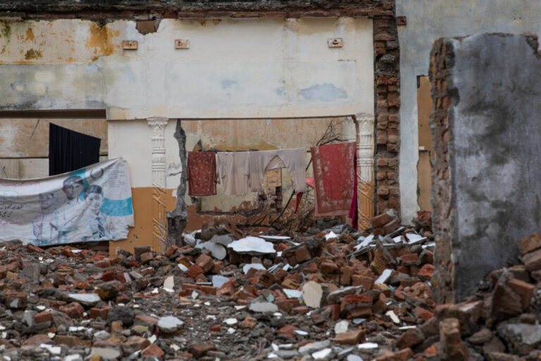 Clothing is seen drying inside a demolished building near Bari Imam on August 20, 2026 in Islamabad, Pakistan.