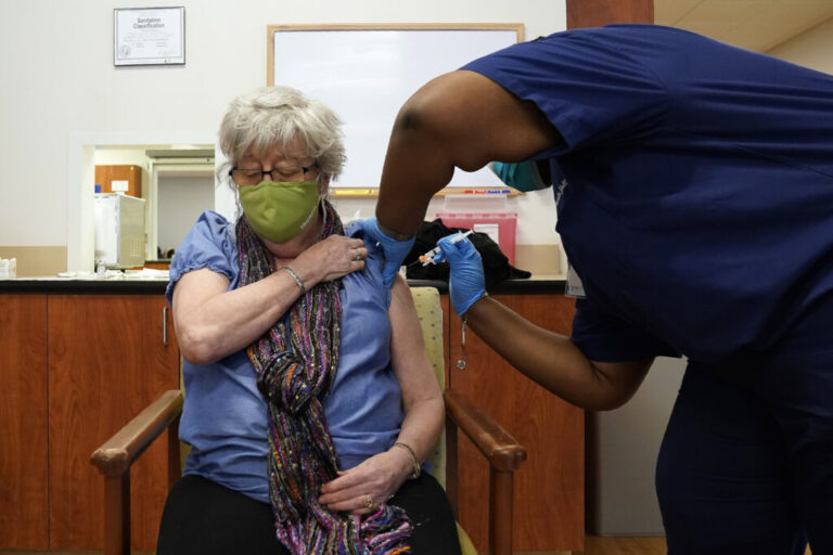 Martha Wilson, of Chapel Hill, gets a COVID-19 vaccine in Pittsboro, N.C at Piedmont Health Senior Care, a federally qualified health center where underserved populations can receive the vaccine.