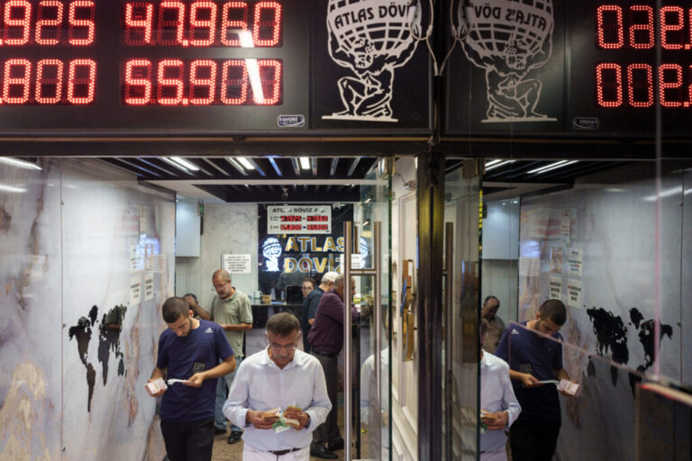 A man exchanges foreign currency at an exchange office in the Grand Bazaar in Istanbul, Turkey, on Aug. 20, 2026. The Grand Bazaar is one of the world's oldest covered markets. Today, many Turks still prefer it over banks when buying or selling gold, where they can often find better exchange rates.