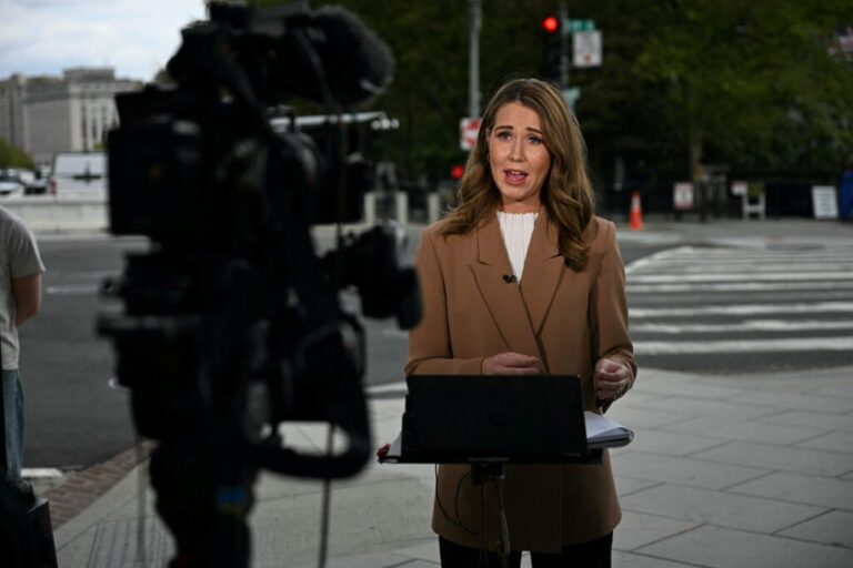 CNN reporter Julia Benbrook gives a live report near the White House on September 19, 2026. One day later, CNN, MSNow and Politico sued the Trump administration on First Amendment grounds for blocking their reporters' access to the White House.