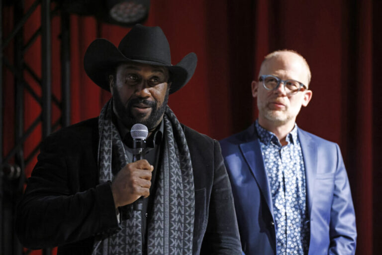 John Boyd Jr., left, and filmmaker Josh Tickell speak at the Washington premiere of “Common Ground” on Nov. 13, 2023. Boyd is a fourth-generation Virginia farmer and president of the National Black Farmers Association.
