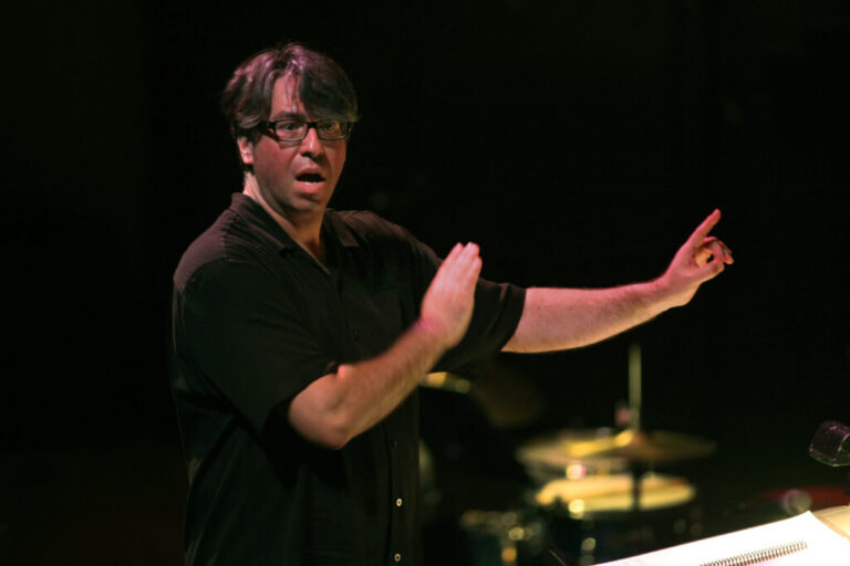 Julian Wachner conducts the choir of Trinity Wall Street and the Bang on a Can All-Stars at Lincoln Center in New York in 2014. Wachner, who was dismissed from his position at Trinity in 2022, has been charged with possession of child sex abuse material in Indiana.