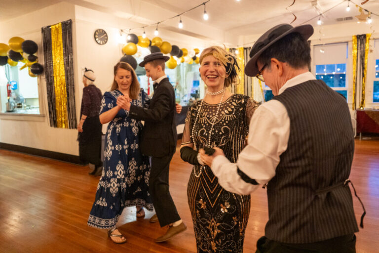Buster Keaton Conference attendees Joy Blatchford (from left) dances with her son Aden Blatchford and Katrina Nguyen dances with her husband Khoi Nguyen at a 1920s themed dance in Cottage Grove, Ore. Aden, Katrina and Khoi are dressed in 1920s clothes.