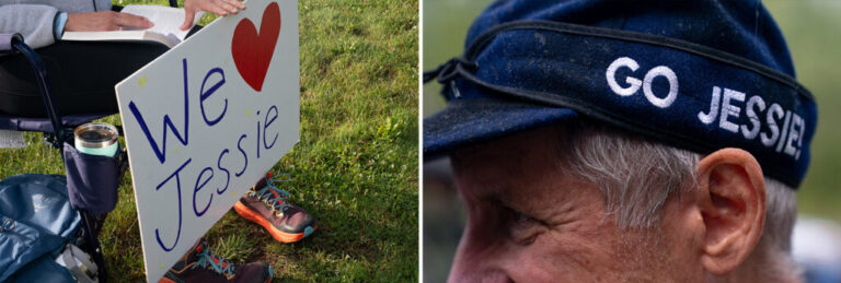 A spectator holds a sign and Mark Raderstorf wears a