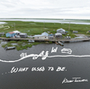 Bertha and Wilson Twitchell stand outside their home in Kasigluk, Alaska. Wilson grew up here. He drew an image of what the land looked like when he was young: Grass and dry land surrounded the house, stretching at least 80 feet to the riverbank, where he remembers playing with toy boats. Now, when the water is particularly high, the house is nearly an island.