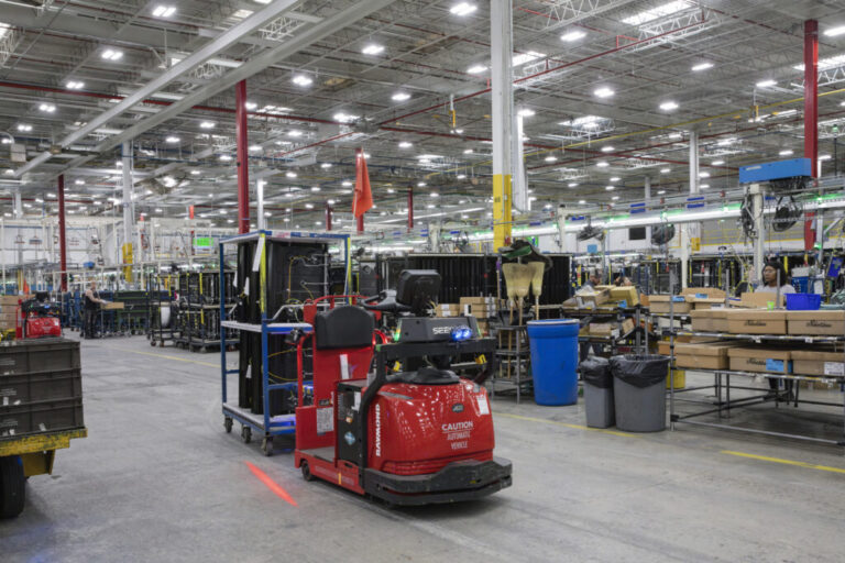 GE Appliances uses a mix of both mobile and stationary robots across its facilities to optimize material movement, assist on the factory floor, and transport finished products from the assembly line to distribution facilities.. Mobile robots are a critical part of the logistics network, delivering parts, raw materials, and finished goods to the assembly lines. AMRs operate using digital maps, cameras, and sensor technologies, allowing them to dynamically adjust routes and operate flexibly and AGVs follow fixed paths using embedded infrastructure and are optimized for consistent, repeatable workflows. Roper Corporation, a wholly owned subsidiary of GE Appliances, a Haier company