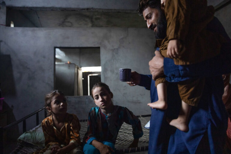 Muhammad Asif, whose children Muhammad Yaseen and Manahil tested postiive for HIV after receiving care from Valika Hospital, sits in his home on July 25, 2026 in Karachi, Pakistan. Asif's children were diagnosed with HIV after seeking treatment at Valika Hospital for a fever.