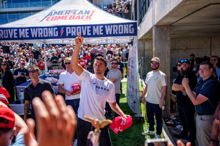 Charlie Kirk throws hats to the crowd after arriving at Utah Valley University.
