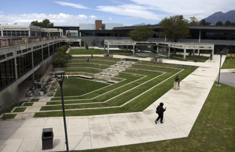 People walk near the site where conservative activist Charlie Kirk was killed on the campus of Utah Valley University in Orem, Utah on Aug. 28, 2026.