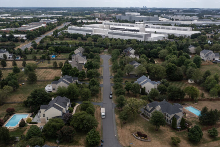In an aerial view, various data centers are shown situated near a neighborhood on July 17, 2024 in Ashburn, Va. Northern Virginia is home to 319 mapped data centers — about 19% percent of the country’s facilities.