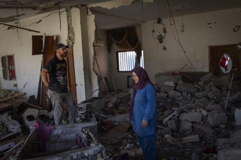 Mahasen Fakih in her destroyed apartment. She returned to Zawtar al-Gharbieh recently after being displaced to the Chouf region, but there is still fighting nearby.