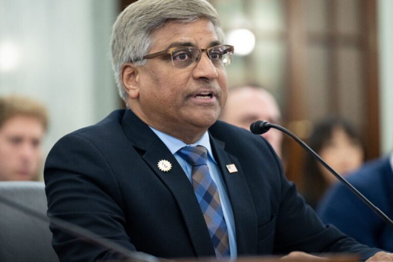 In this 2023 photo, Sethuraman Panchanathan, then the director of the National Science Foundation, testifies at a Senate committee hearing. He's wearing a suit and is seated in front of a microphone.