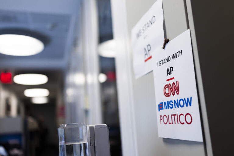 WASHINGTON, DC - SEPTEMBER 21: Signs of support for AP, CNN, MS NOW and POLITICO hang on the White House grounds on September 21, 2026 in Washington, DC. Reporters from MS NOW, CNN, and Politico have been blocked from accessing the White House since September 19th after President Trump said he was banning the three outlets from the property. Those news organizations are now suing President Trump, alleging that it violates the First Amendment.