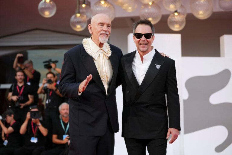 John Malkovich, left, and Sam Rockwell pose for photographers at the red carpet for the film 'Wild Horse Nine' during the 83rd edition of the Venice Film Festival in Venice, Italy, on Thursday, Sept. 3, 2026. (Photo by Alessandra Tarantino/Invision/AP)