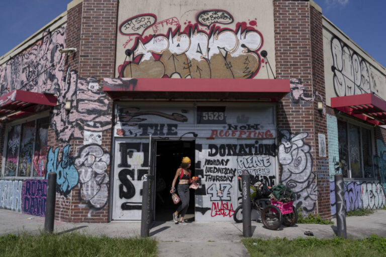 A person walks through the entrance of the New Orleans Free Store, in the Lower Ninth Ward of New Orleans, La. on Aug. 20, 2026.