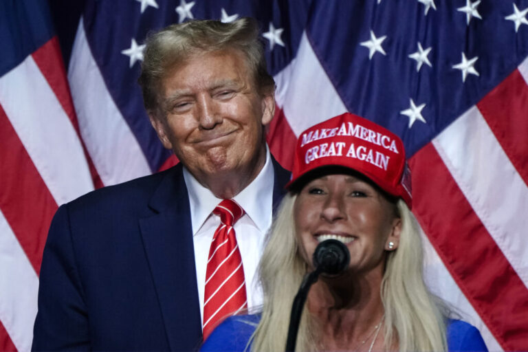 In this file photo, Rep. Marjorie Taylor Greene (R) speaks alongside President Trump at a campaign event when he was a presidential candidate, in Rome, Georgia, on March 9, 2024.