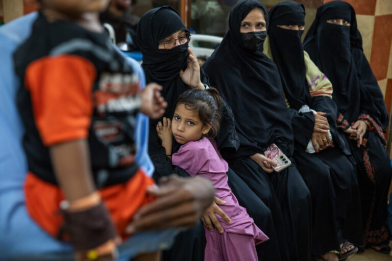 Parents and children wait for care at Kulsum Bai Valika Hospital on July 25, 2026 in Karachi, Pakistan. Families say their children tested positive for HIV after syringes were used on multiple children seeking treatment for other illnesses.