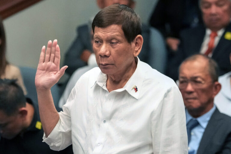 Former Philippine President Rodrigo Duterte takes oath during a senate inquiry on the so-called war on drugs during his administration at the Philippine Senate, on Oct. 28, 2024, in Manila, Philippines.