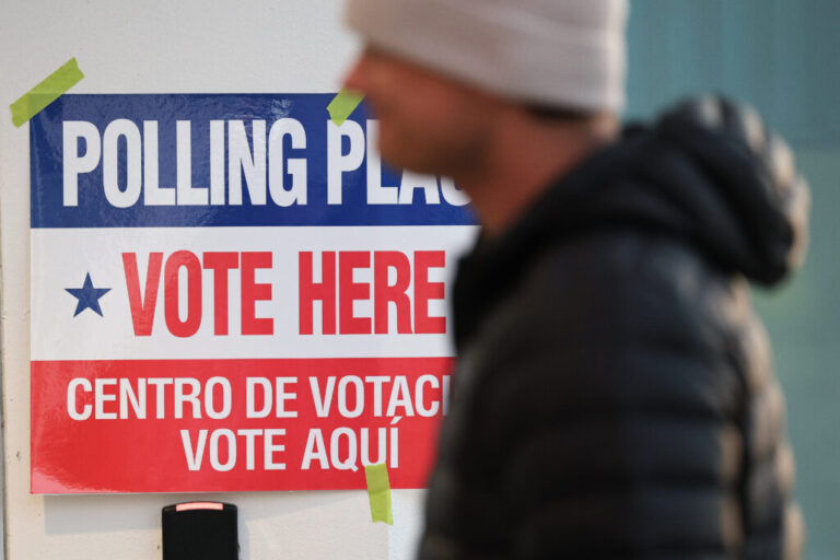 Voters arrive before casting their ballots at a polling location in Arlington, Va., on April 21.