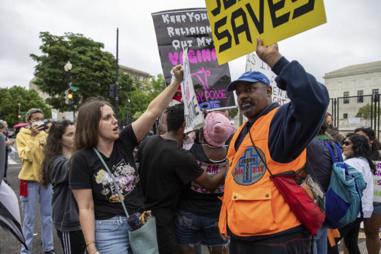 An abortion-rights protester, left, faces off against an anti-abortion protester in front of the U.S. Supreme Court in 2022.