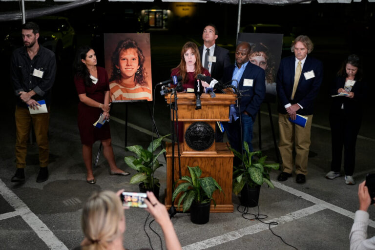 Public radio reporter Catherine Sweeney, one of the media witnesses, recounts the moments before the execution of Christa Pike was halted last Wednesday, Sept. 30. (AP Photo/George Walker IV) Flanking the podium are two photos of Colleen Slemmer, Pike's victim in the 1995 murder.