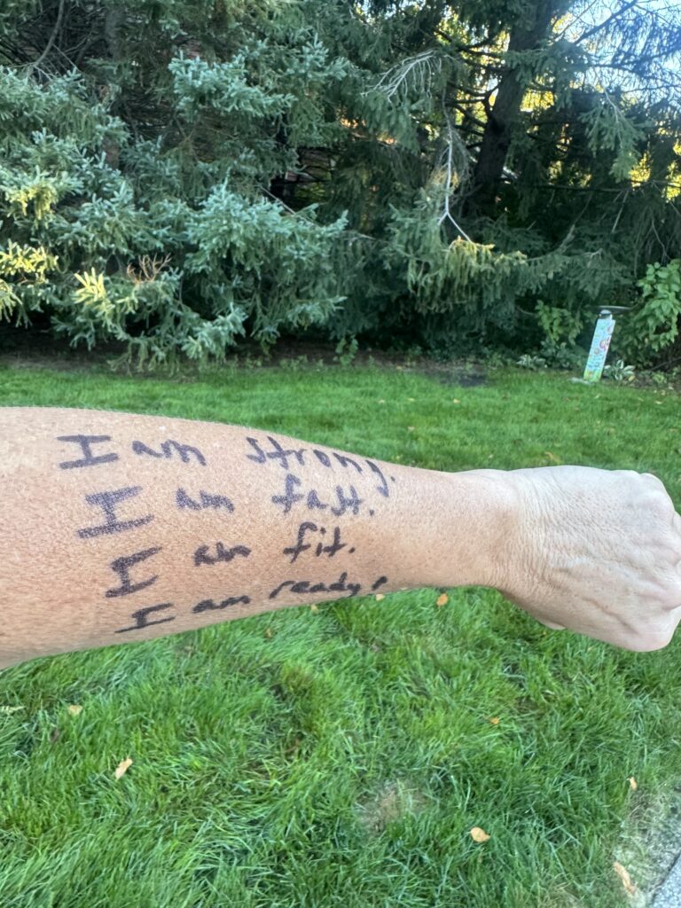 Confidence coach Cindra Kamphoff wrote these positive phrases on her arm to combat self-doubt during a 2012 marathon.