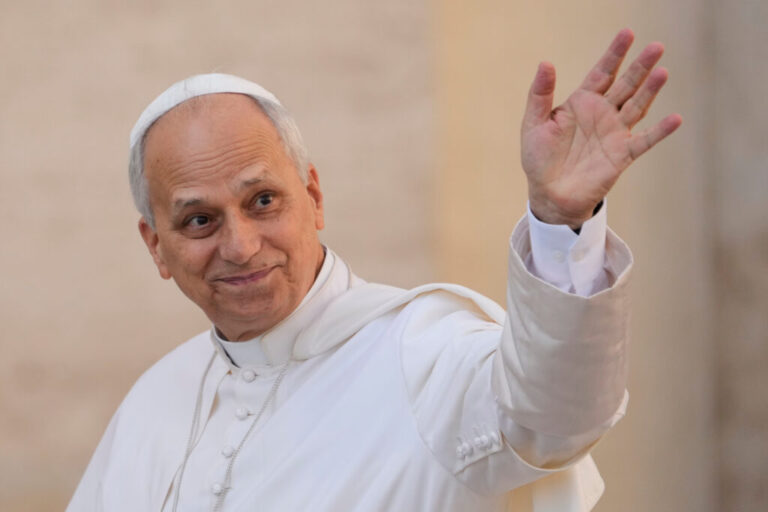 Pope Leo XIV waves as he arrives for his weekly general audience in St. Peter's Square at the Vatican on Oct.1, 2025.