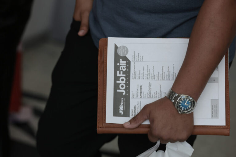 SUNRISE, FLORIDA - SEPTEMBER 25: A job seeker holds paperwork during the Mega JobNewsUSA South Florida Job Fair held in the Amerant Bank Arena on September 25, 2026 in Sunrise, Florida. Hiring managers and recruiters from more than 50 companies attended the job fair to recruit workers for opportunities across a range of companies. (Photo by Joe Raedle/Getty Images)