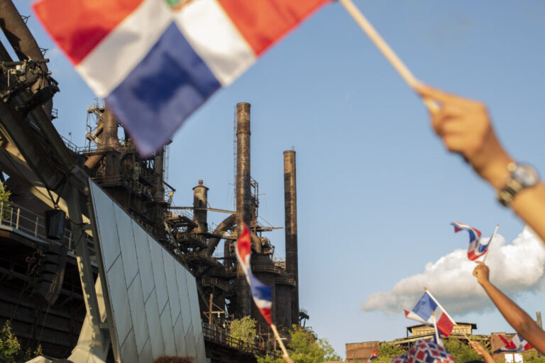 Festival goers dance at the Dominican Festival, on Sept. 13, 2026 at the Levitt Pavilion SteelStacks, in Bethlehem, Pa. Latino voters are a decisive voting bloc in Pennsylvania's highly competitive 7th Congressional District midterm race as both parties aggressively court the region's Hispanic community.
