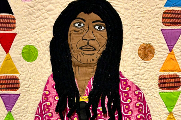 Tyler uses applique, yarn, jewelry, charcoal and other mixed media to emphasize the humanity of the people still serving long sentences at Angola and other prisons, as this detail of
