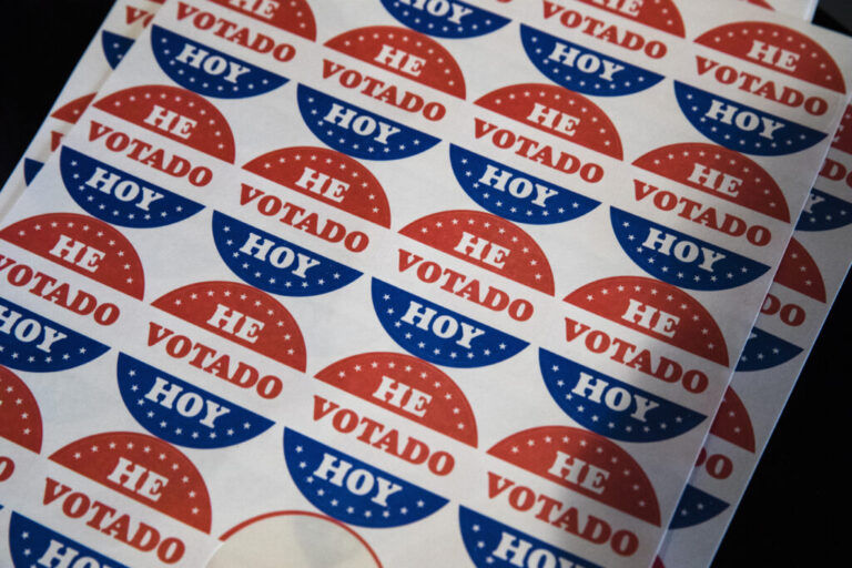 Democrats are trying to rebuild trust among Latino voters, and turning to content creators for help. Above, Spanish language voting stickers which read