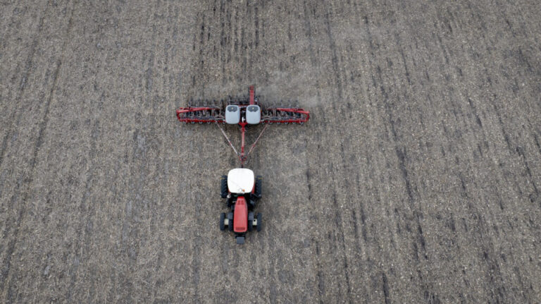 In this aerial view, Dan Duffy uses a tractor to plant soybeans on land he farms with his brother on April 28, 2025 near Dwight, Illinois.
