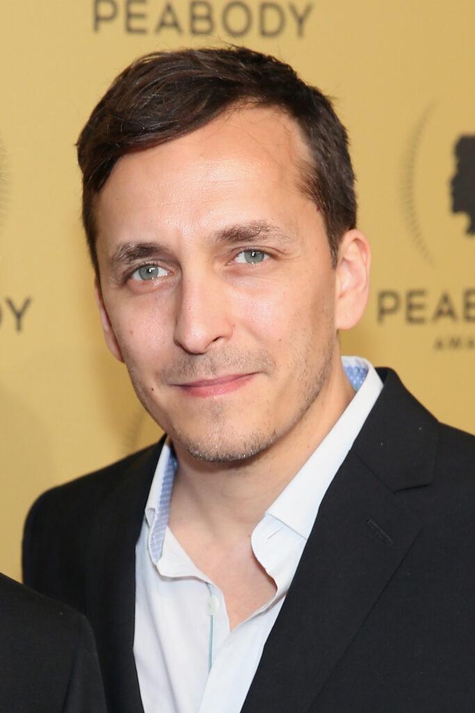 Brent Renaud is photographed at the Peabody Awards ceremony in 2015. A backdrop behind him says