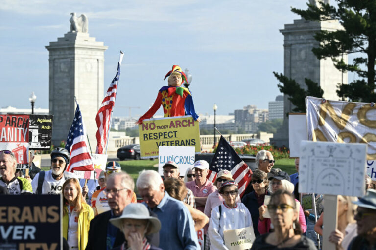 Demonstrators gathered Thursday morning to protest Trump's proposed arch, which would stand in a traffic circle on the bridge connecting the National Mall to Arlington National Cemetery.